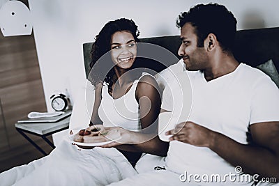 Afro American Couple Having A Dinner In Bedroom. Stock Photo