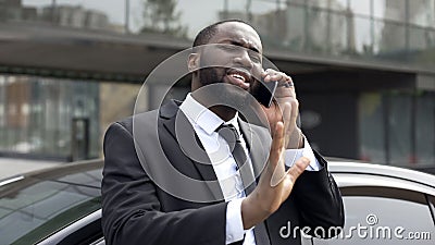 Afro-American diplomat negotiating by phone, defending his interests and opinion Stock Photo