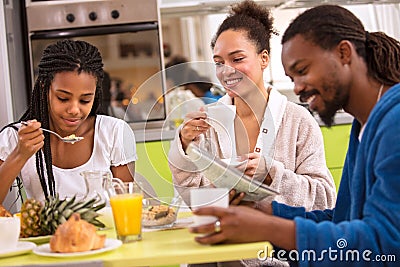 Afro American girl with patents having breakfast Stock Photo