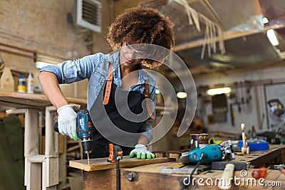 Young woman doing woodwork in a workshop Stock Photo