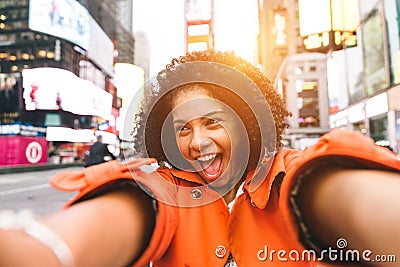 Afro american woman taking selfie in Time square, New york Stock Photo