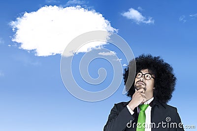 Afro businessman with empty speech bubbles Stock Photo