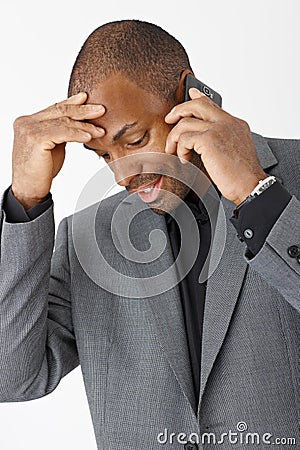 Afro businessman talking on phone Stock Photo