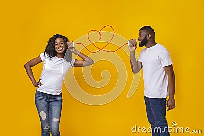 Afro guy singing love song to his girlfriend Stock Photo