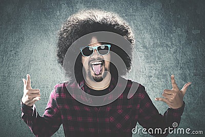 Afro man with silly gesture Stock Photo