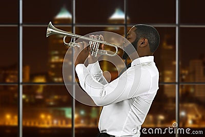 Afro trumpeter playing music. Stock Photo