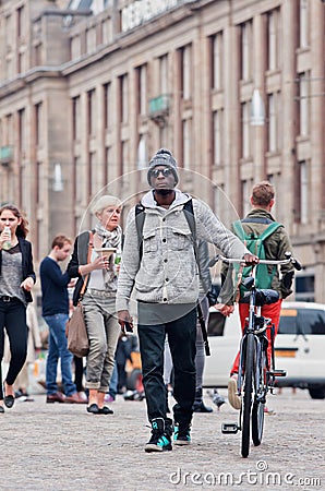 Afro young man on the Dam Square, Amsterdam, Netherlands Editorial Stock Photo