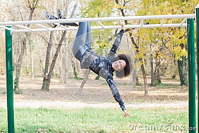 Afro Young Woman Fun At Outdoor Fitness Park Stock Photo