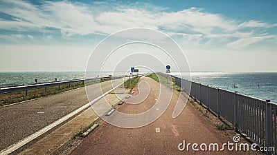 The Afsluitdijk is the thirty-two kilometer long connection between the Dutch provinces of North Holland and Friesland Stock Photo