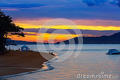 Beautiful reddish sky during the sunset. Coast Stock Photo