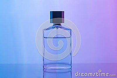Aftershave, cologne, perfume bottle set on dark purple background with reflection. Men`s perfume Stock Photo