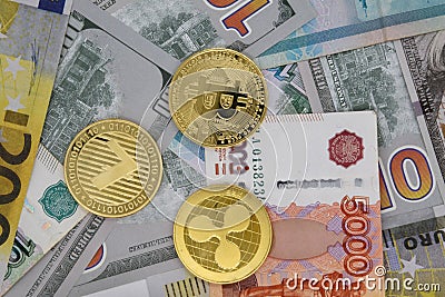 Different cryptocurrencies in the form of gold coins Editorial Stock Photo