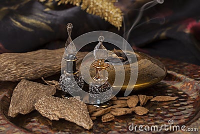 Agarwood incense chips and essential oil Stock Photo