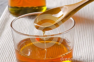 Agave syrup pouring on a glass. Stock Photo