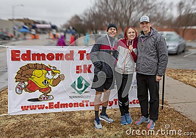 Age group medal winners 9th annual Edmond Turkey Trot on a rainy day in Edmond, Oklahoma. Editorial Stock Photo