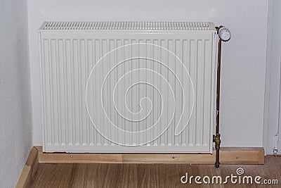 Age plates radiator with thermostatic valve. Stock Photo