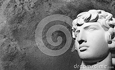 Age of Renaissance Greek plaster figure head antine on a dark background Stock Photo