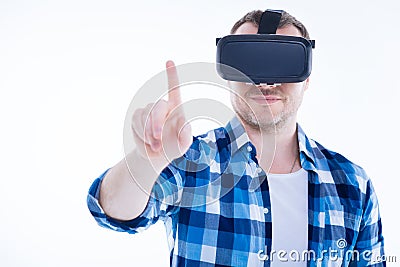 Positive smart man pressing finger to the sensory screen Stock Photo