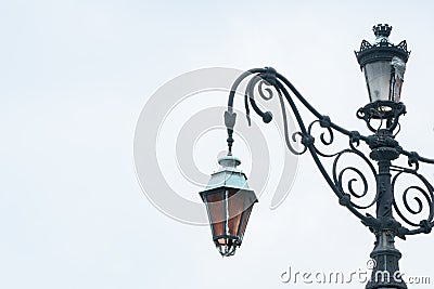 Aged european classic street lamp with broken on the apex Stock Photo