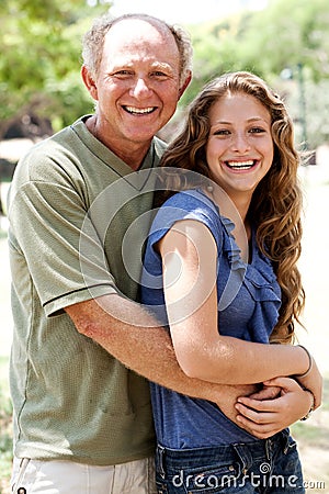 Aged father embracing her daughter Stock Photo