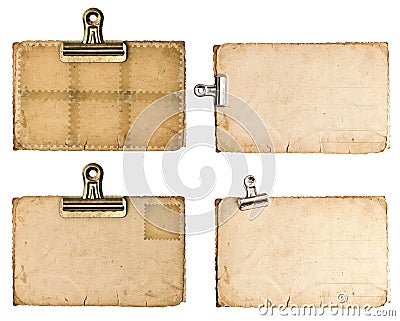 Aged paper sheets with metal clip isolated on white Stock Photo