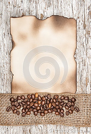 Aged sheet of paper with coffee beans and burlap ribbon Stock Photo