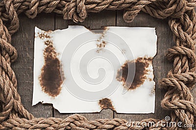 Aged sheet of paper and rope Stock Photo