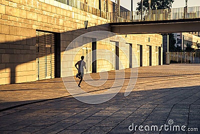 Aged sportsman running on country road, healthy inspirational fitness lifestyle, sport motivation speed interval training. Stock Photo