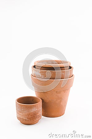 aged terracotta flowerpots on a white surface Stock Photo