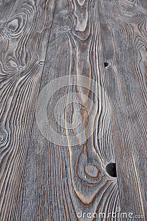 Aged and tinted pine boards with knots and a pronounced structure Stock Photo