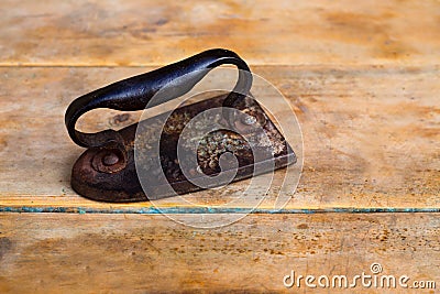 Aged vintage clothes iron in rusted metal Stock Photo