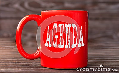 AGENDA - word on a red cup on a dark background Stock Photo