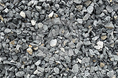 Aggregate of coarse gray stones, crushed at a stone pit, gravel pattern Stock Photo