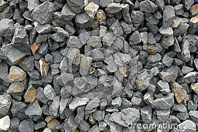 Aggregate / gravel consisting of larger dark and light gray coarse stones, crushed and broken at a stone pit Stock Photo