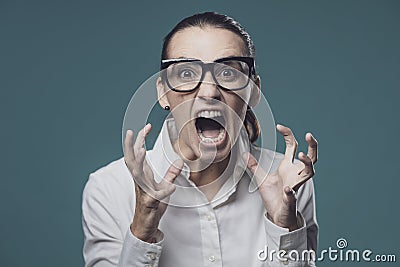 Aggressive angry woman shouting at camera Stock Photo