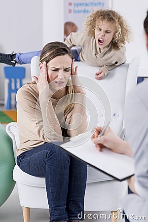 Aggressive child and depressed mother Stock Photo