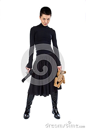 The aggressive girl with a pistol and teddy bear Stock Photo