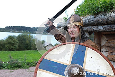 Aggressive man in viking armor Stock Photo