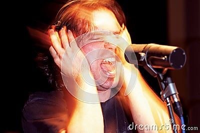 Aggressive singer in studio Stock Photo