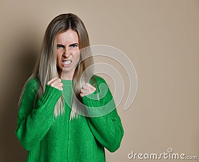 Aggressive woman boxing. Expression emotion and feelings concept. Stock Photo