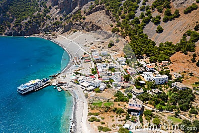 AGIA ROUMELI, CRETE, GREECE - JULY 20 2021: Aerial view of the village of Agia Roumeli at the exit of the Samaria Gorge on the Editorial Stock Photo