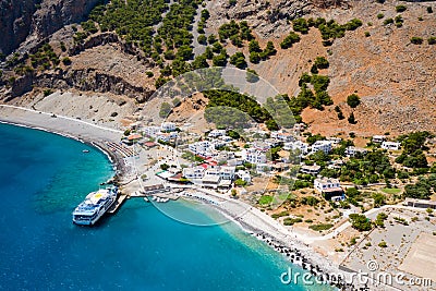 AGIA ROUMELI, CRETE, GREECE - JULY 20 2021: Aerial view of the village of Agia Roumeli at the exit of the Samaria Gorge on the Editorial Stock Photo