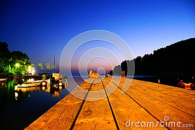 Agnontas beach and bay at night, Greece Stock Photo