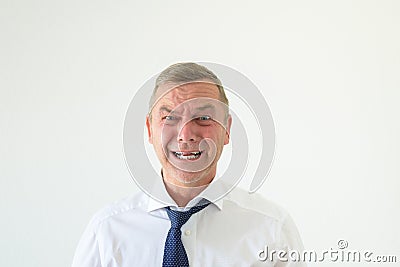 Agonised man looking at the camera in anguish Stock Photo