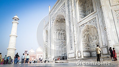 Taj Mahal front entrance view in Agra, India with tourists in front Editorial Stock Photo