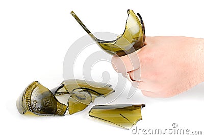 Agression.Arm hold shattered green bottle Stock Photo