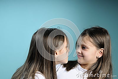 agressive twin sisters in conflict Stock Photo