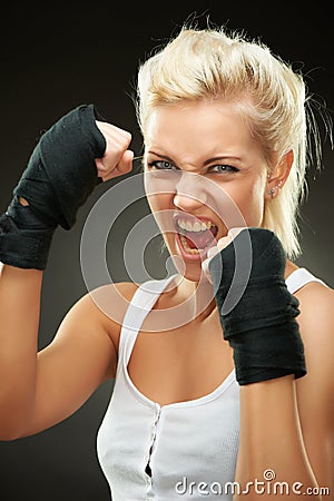 Agressive young beautiful blond boxer girl Stock Photo
