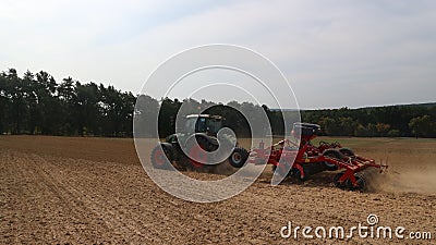 Agricultural machinery - tractors, seeders, sprayers and cultivators work in the field Editorial Stock Photo