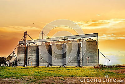 Agricultural silos at sunset Stock Photo